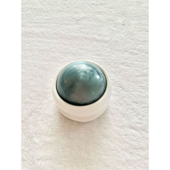 Light blue and white roller massage ball ￼ - Picture 1 of 3